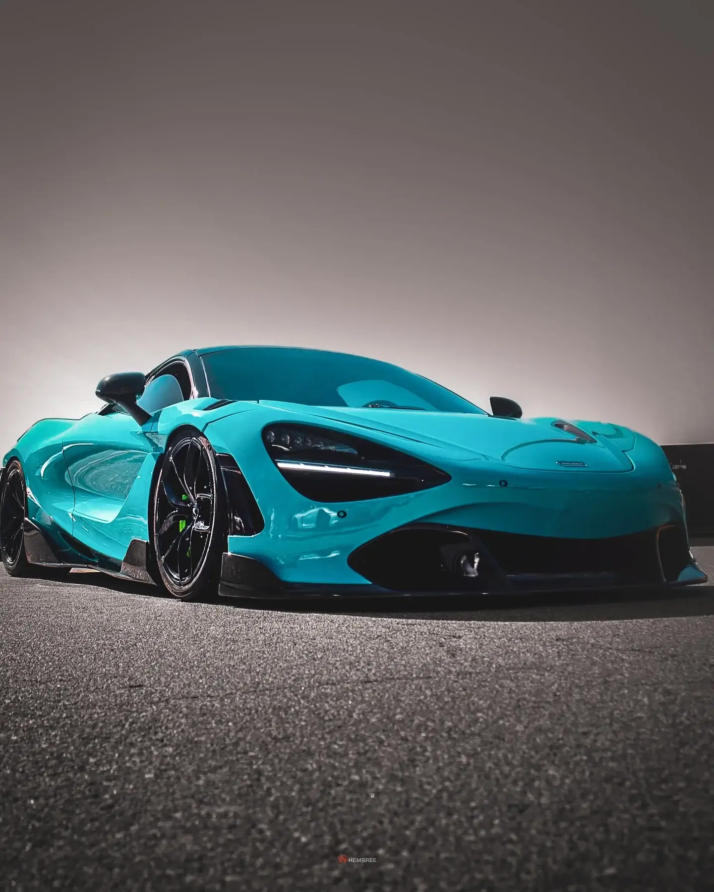 Light blue McLaren 720S with a gloss wrap finish by CustomsByAli in Elyria, OH