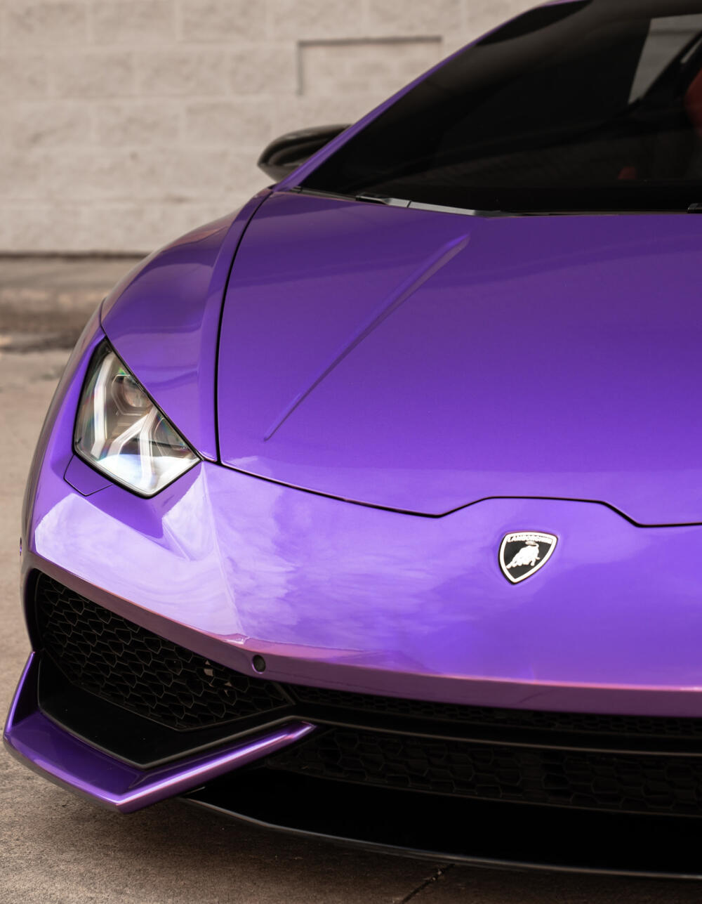 Vibrant purple Lamborghini color change vinyl wrap at CustomsByAli in Elyria, OH